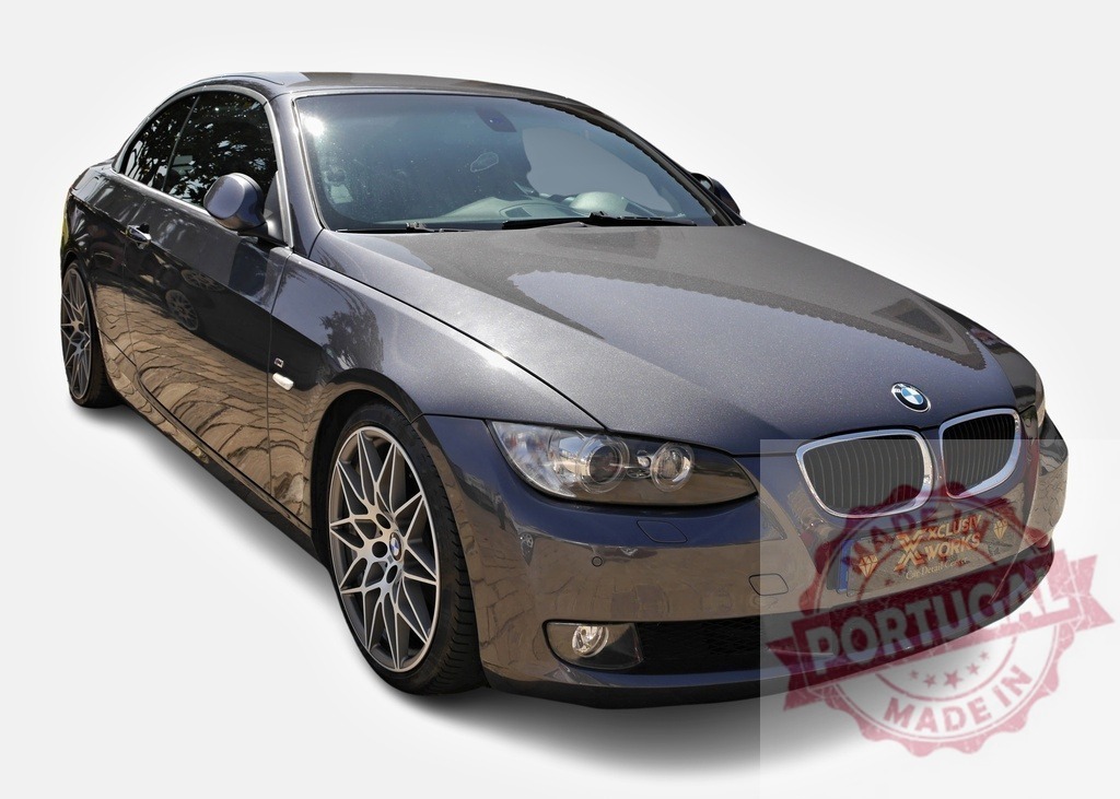 Metallic gray BMW 3 series convertible parked on a sunny day | Stylish gray BMW convertible parked, showcasing its sleek design and sporty features - Realized with Pictrs.com