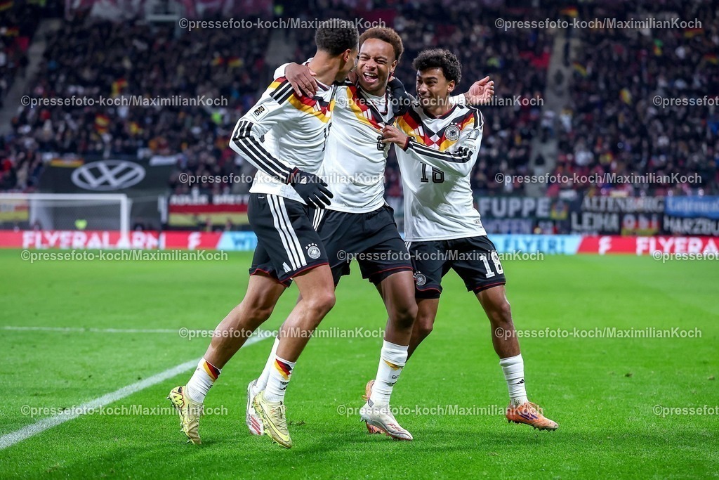 DFB17112501171 | 17.11.2025, Fußball, Länderspiel, WM-Qualifikation Europa, Deutschland - Slowakei, Red Bull Arena (Leipzig), 10. Spieltag, Saison 2025 2026: Torjubel nach dem Tor zum 6:0 durch Torschütze Forzan Assan Ouedraogo (GER #09)  zusammen mit Felix Nmecha (GER #13) und Nathaniel Brown (GER #18)   Regulations prohibit any use of photographs as image sequences and or quasi-video.