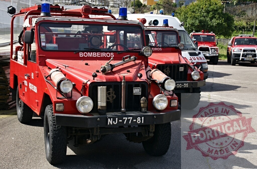 Red bombeiros emergency vehicles ready for rescue in Portugal | Red bombeiros emergency vehicles, including fire trucks and an ambulance, parked ready for action - Realisiert mit Pictrs.com