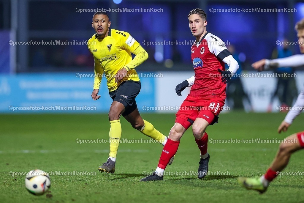 FCVK14022502137 | 14.02.2025, Fußball, FC Viktoria Köln – Alemannia Aachen, 3.Liga, Sportpark Höhenberg, Saison 2024 2025: Florian Heister (Alemannia Aachen #19) im Zweikampf gegen Donny Bogicevic (Viktoria Köln #8)DFB regulations prohibit any use of photographs as image sequences and or quasi-video.