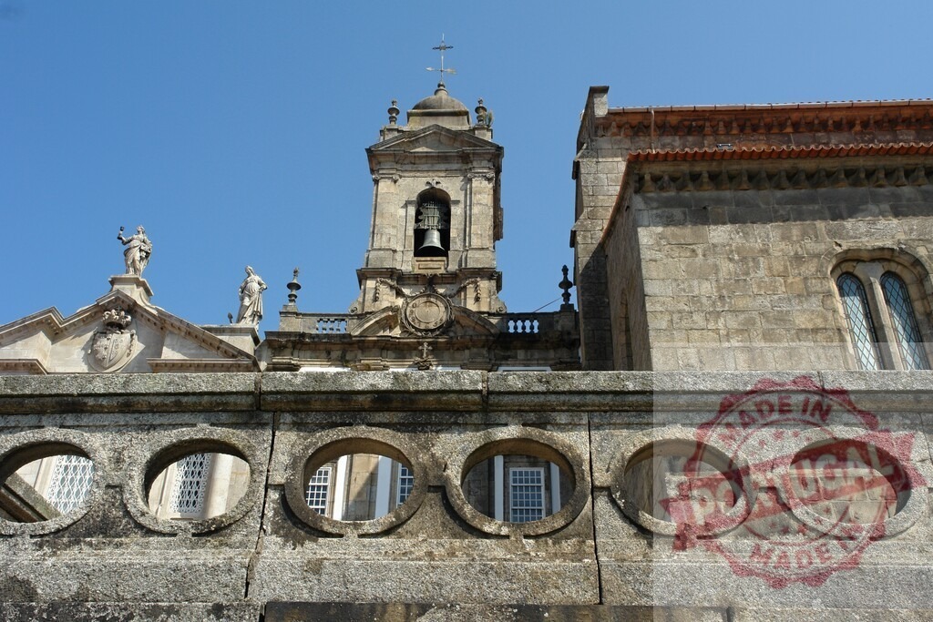 Sé de Braga bell tower and historic facade detail. Porto - Portugal | Sé de Braga, a historic cathedral in Braga, featuring a bell tower and stone architecture - Realized with Pictrs.com