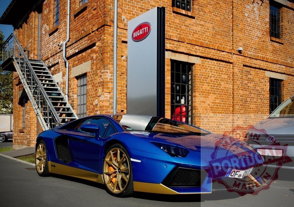 Lamborghini Aventador sports car parked at Bugatti Automobil with brick building | Lamborghini Aventador sports car with gold wheels parked in front of brick building with Bugatti sign - Realized with Pictrs.com