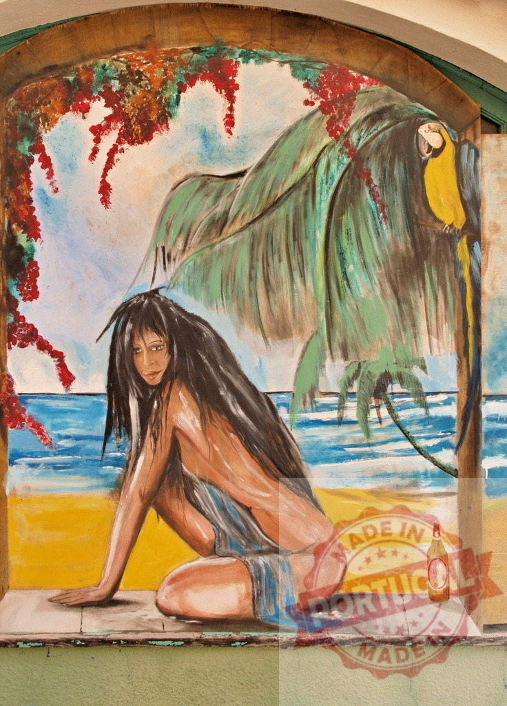 Mural depicting woman on tropical beach with parrot | Artistic mural showing a woman kneeling on a tropical beach with a palm tree, parrot, and ocean - Realisiert mit Pictrs.com
