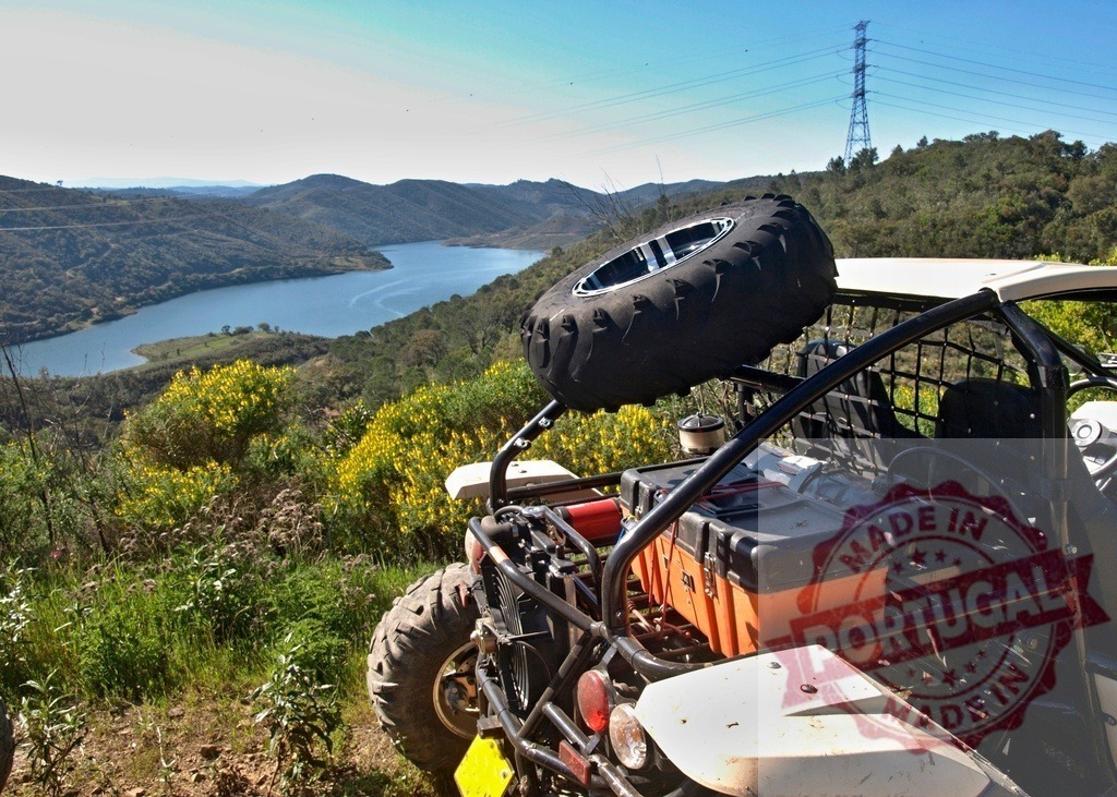 ATV off-road adventure exploring scenic mountain landscape | Off-road vehicle parked on a mountain trail overlooking a lake and distant hills - Realisiert mit Pictrs.com