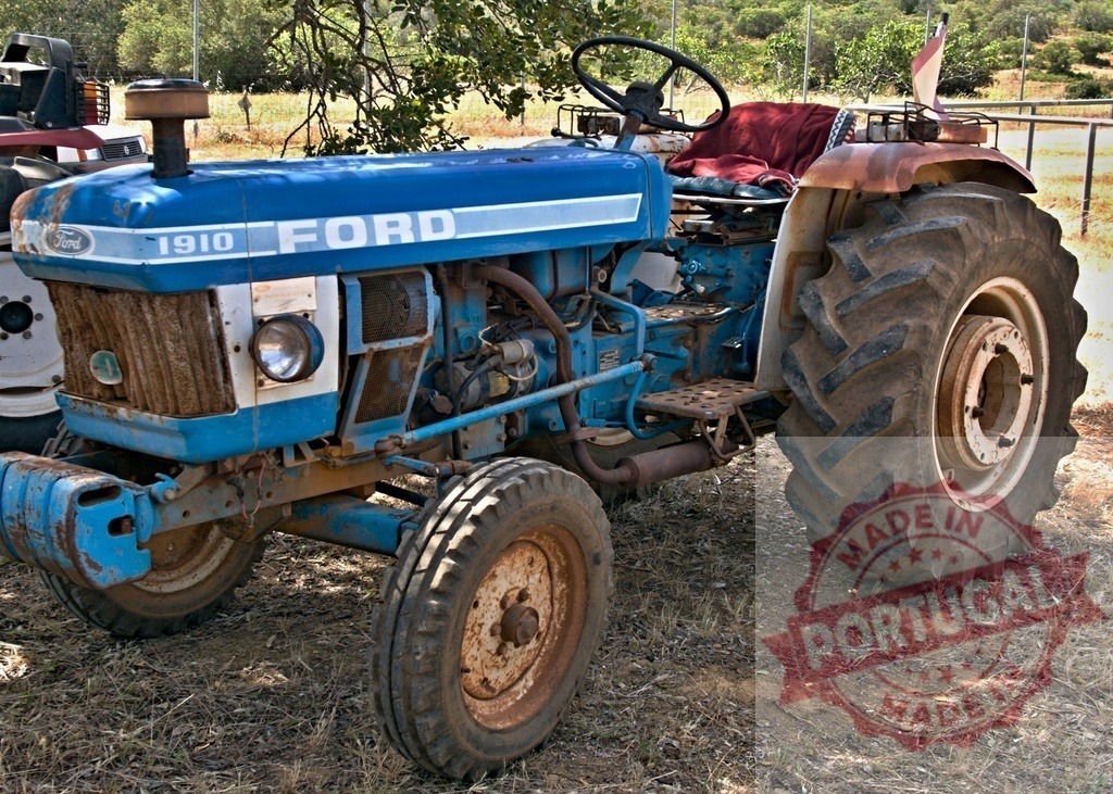 Old blue Ford 1910 tractor working in agriculture | Old blue Ford 1910 tractor standing outdoors, representing farming and rural life - Realized with Pictrs.com