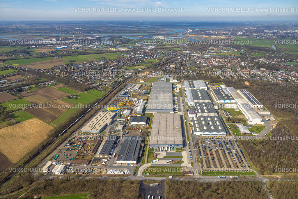Voerde240309411 | Luftbild, Gewerbegebiet Am 
Industriepark, ehemaliges Gelände der Babcock-Fabrik, Ausbau der Betuweroute und Betuwe-Linie Eisenbahnstrecke und Güterzug, Friedrichsfeld, Voerde, Nordrhein-Westfalen, Deutschland