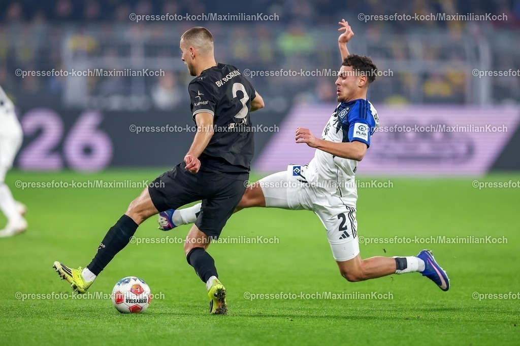 BVB21032601063 | 21.03.2026, Fußball, Borussia Dortmund - Hamburger SV, 1. Fußball Bundesliga, 27. Spieltag, Signal Iduna Park, Saison 2025 2026: Waldemar Anton&nbsp;(BVB #03) im Zweikampf gegen  William Mikelbrencis&nbsp; (HSV #02)   DFB regulations prohibit any use of photographs as image sequences and or quasi-video.