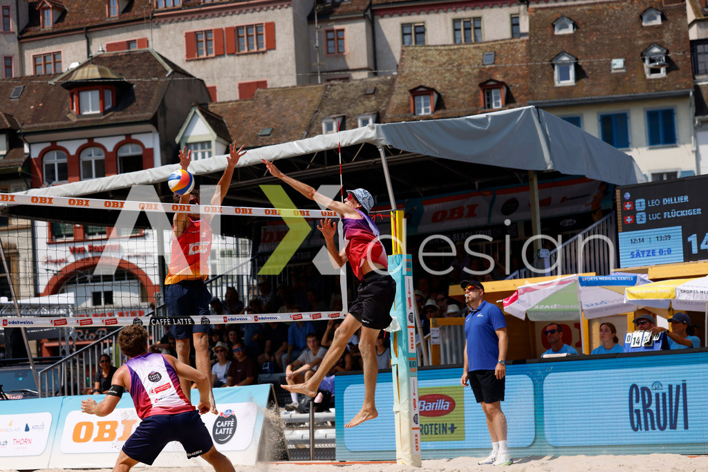 Obi BeachTour 2026 - Basel | BASEL, SWITZERLAND - JULY 19: SIMON HAGENBUCH (SUI) attack / spike against LUC EMANUEL FLÜCKIGER (SUI) block during the Obi BeachTour 2026 match between DILLIER / FLÜCKIGER (SUI) and HAGENBUCH / HAUSSENER (SUI) at Barfüsserplatz on July 19, 2026 in Basel, Switzerland. - Realisiert mit Pictrs.com