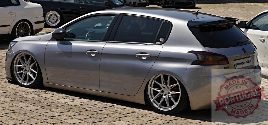 Peugeot 308 hatchback with lowered suspension and custom alloy wheels | Peugeot 308 showing custom modifications for car lovers and tuning enthusiasts - Realized with Pictrs.com