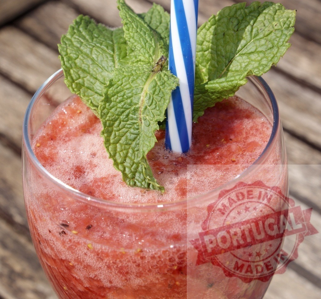 Strawberry mint smoothie refreshing cool summer drink | Strawberry mint smoothie with a straw and garnish, providing a refreshing summer drink - Realized with Pictrs.com