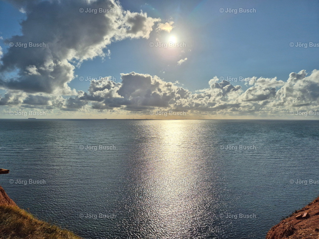 Sonne und Wolken über der Norsee_ Helgoland | Dieser Shop bietet Fotos und Videos aus den Bereichen Fallschirmspringen, Landschaft und Luftbild - Realisiert mit Pictrs.com