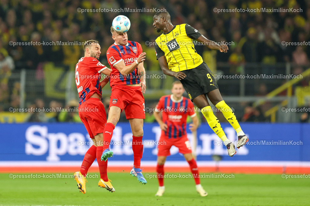 BVB13092401018 | 13.09.2024, 1. Fußball Bundesliga, Borussia Dortmund - 1. FC Heidenheim 1846, Signal Iduna Park, Saison 2024 2025: Kopfball Zweikampf Kopfballduell Lennard Maloney (Heidenheim #33) gegen Serhou Guirassy (BVB #9)DFB regulations prohibit any use of photographs as image sequences and or quasi-video.