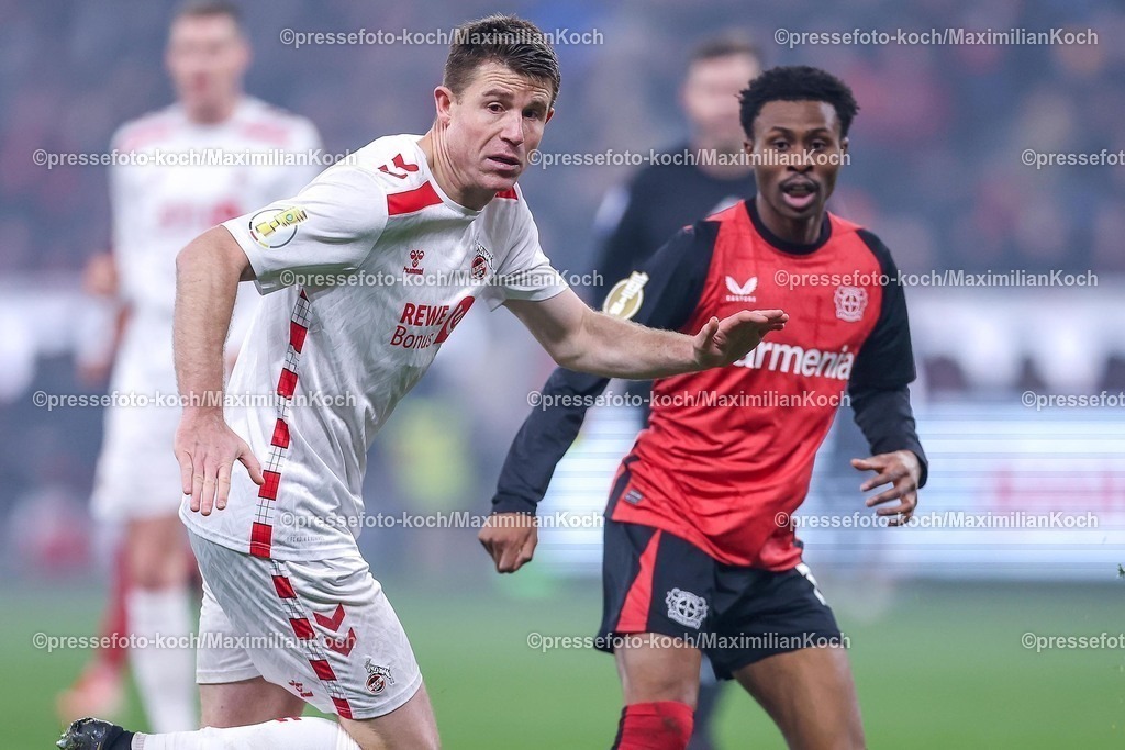 DFB05022502302 | 05.02.2025, Fußball, DFB-Pokal Viertelfinale, Bayer 04 Leverkusen - 1.FC Köln, BayArena, Saison 2024 2025: Dominique Heintz (FC Köln #3) im Zweikampf gegen Nathan Tella (Bayer04 Leverkusen #19)DFB regulations prohibit any use of photographs as image sequences and or quasi-video.