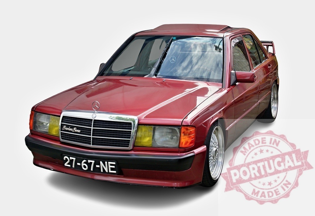 Mercedes-Benz 190E W201 vintage red tuned sedan | Red Mercedes-Benz 190E W201 sedan on a clean white background - Realized with Pictrs.com