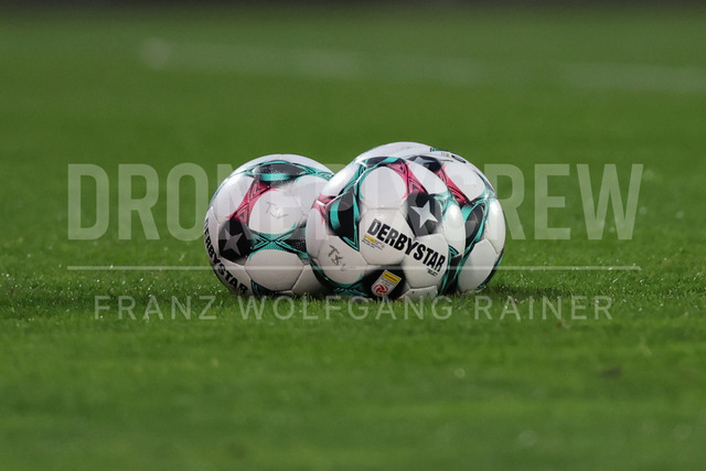 TSV Egger Glas Hartberg vs SV Oberbank Ried – Austrian Bundesliga Match | TSV Egger Glas Hartberg and SV Oberbank Ried. High-intensity match action, tackles, shots on goal, celebrations, fan atmosphere and stadium scenes captured in professional quality. The image shows matchballs.