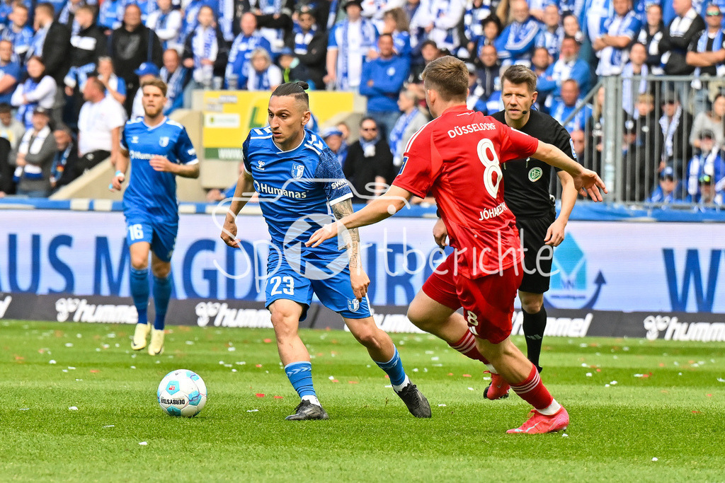 1. FC Magdeburg - Fortuna Düsseldorf | im Duell Baris ATIK (FC Magdeburg 23) und Isak Bermann JOHANNESSON (Fortuna Duesseldorf 8) / Zweikampf / 2. Bundesliga: 1. FC Magdeburg - Fortuna Duesseldorf, Avnet-Arena am 18.05.2025 / DFL REGULATIONS PROHIBIT ANY USE OF PHOTOGRAPHS AS IMAGE SEQUENCES AND/OR QUASI-VIDEO