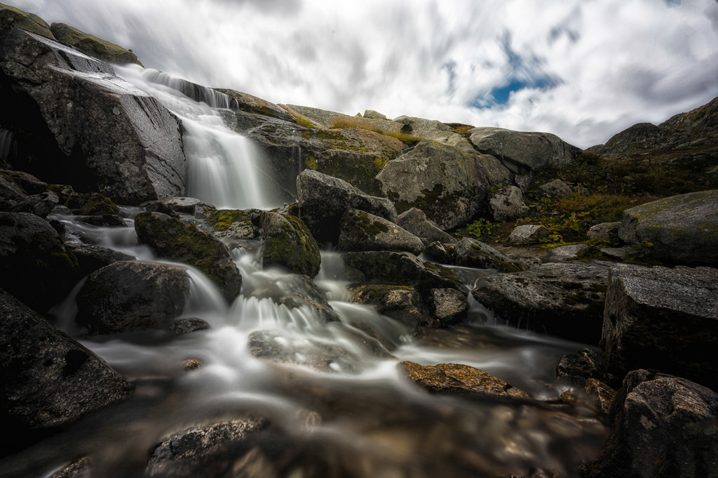 Wasserscheide | Watershed | Dieser Bach, bei dem ich (wie schon öfter) keinen Namen herausgefunden habe, sammelt sich kurz unter der Grimsel-Passhöhe. Dort verläuft die Kontinentalwasserscheide. Während dieser Bach erst in den Grimselsee fliesst, dann via Aare und Rhein in die Nordsee, sammeln sich wenige hundert Meter weiter südlich die Gewässer in der Rhone und strömen ins Mittelmeer. 
-----------------------------------------------------------------
This brook, for which (as I have often done) I have not been able to find a name, collects just below the Grimsel pass. This is the continental watershed. While this stream first flows into the Grimselsee, then via the Aare and Rhine into the North Sea, a few hundred meters further south, the waters of the Rhone gather and flow into the Mediterranean.
watershed
-----------------------------------------------------------------
Dieser Druck ist in einer limitierten Auflage von 5 Exemplaren erhältlich. 
This print is available in a limited edition of 5 copies. 
http://art.hess.photography/149-wasserscheide.html - Realisiert mit Pictrs.com