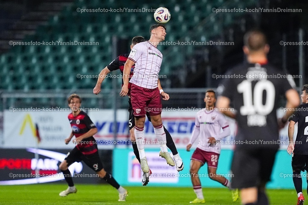 xYDR31102501104 | 31.10.2025, xydrx, Fußball, 3.Liga, FC Viktoria Köln - FC Ingolstadt 04, Saison 2025 2026, Sportpark Höhenberg: Christoph Greger (FC Viktoria Köln #15) im Zweikampf gegen Mads Borchers (FC Ingolstadt #9)  DFB regulations prohibit any use of photographs as image sequences and or quasi-video.